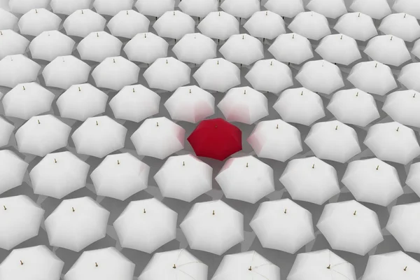 Red umbrella among other white umbrellas — Stock Photo, Image