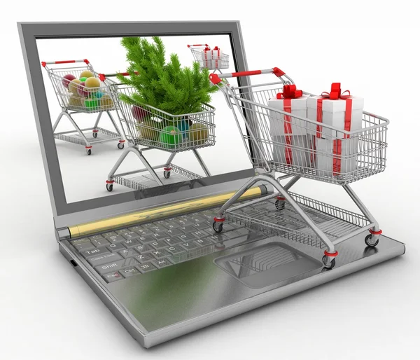Koncepce vánoční online nakupování. přenosný počítač s sváteční nákupní vozíky — Stock fotografie