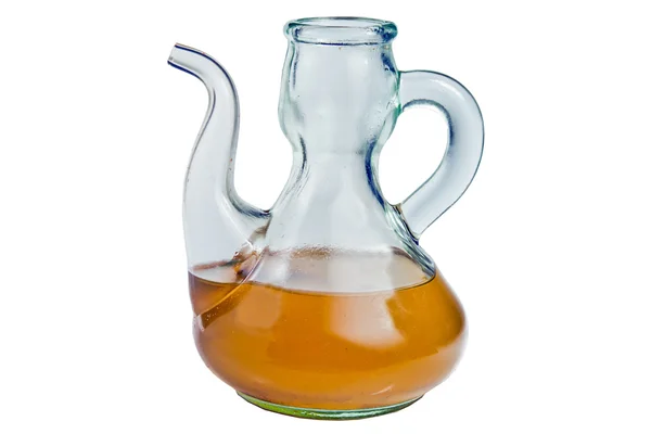 Оливковое масло в стеклянной бутылке на белом фоне — стоковое фото