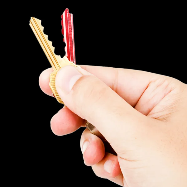 Hand met gekleurde toetsen — Stockfoto