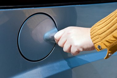 woman in a fuel station clipart