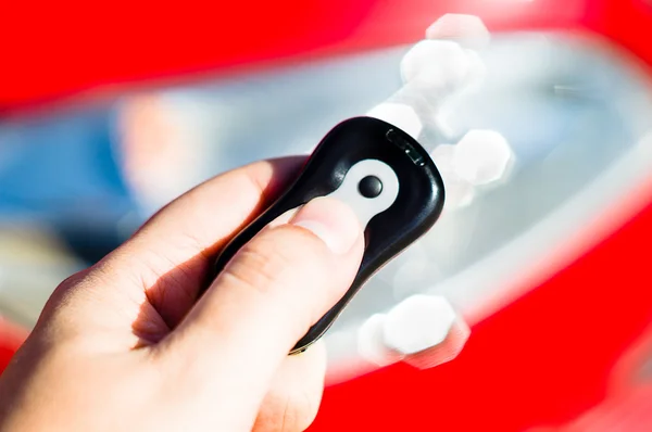 Hand holding a car key — Stock Photo, Image