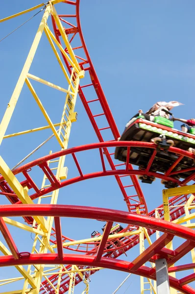 Peoples riding on a rollercoaster — Stock Photo, Image