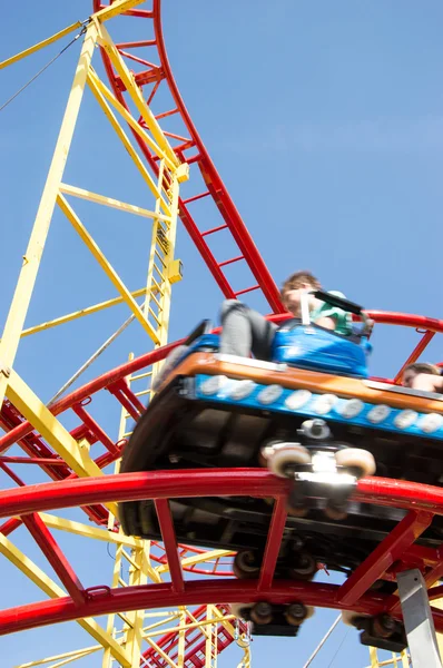 Peoples riding on a rollercoaster — Stock Photo, Image