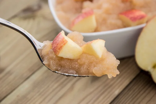 Applesauce on a spoon — Stock Photo, Image