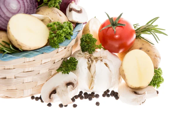 Vegetables in a basket isolated on white — Stock Photo, Image