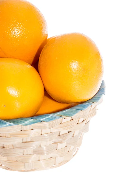Oranges in a basket on white — Stock Photo, Image