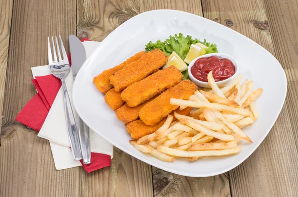 Portion of Fish Fingers on wooden background — Stock Photo, Image