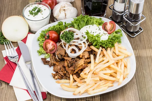 Portion of Kebab meat on a plate — Stock Photo, Image