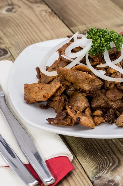 Kebab meat with Onions on a plate — Stock Photo, Image