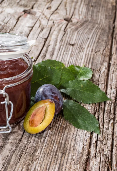 Plum Jam in a glass on wood — Stock Photo, Image