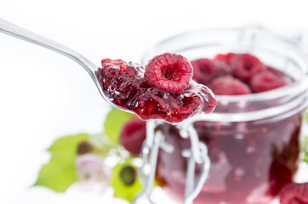 Raspberry Jam with spoon in front — Stock Photo, Image
