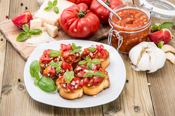 Antipasti (Bruschetta) on a plate — Stock Photo, Image