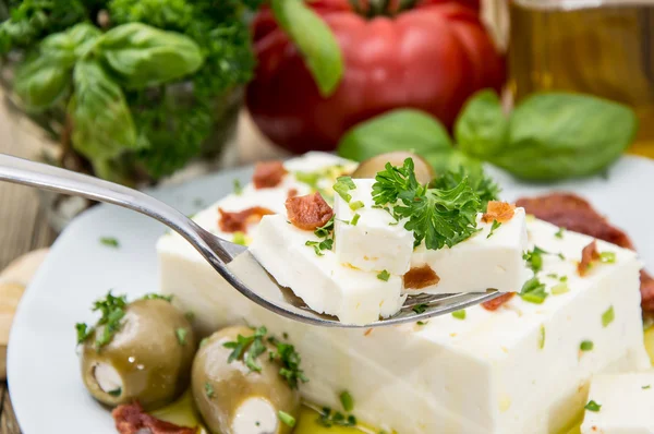 Feta Cheese blocks on a fork — Stok fotoğraf