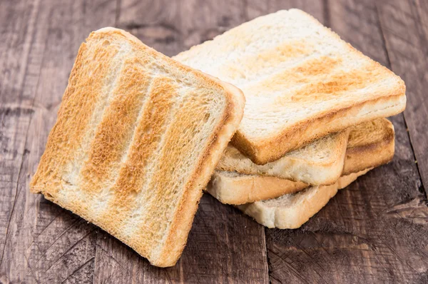Heap of toast on wood — Stock Photo, Image