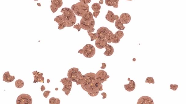 Brun cookies faller ner och forma ett hjärta — Stockvideo