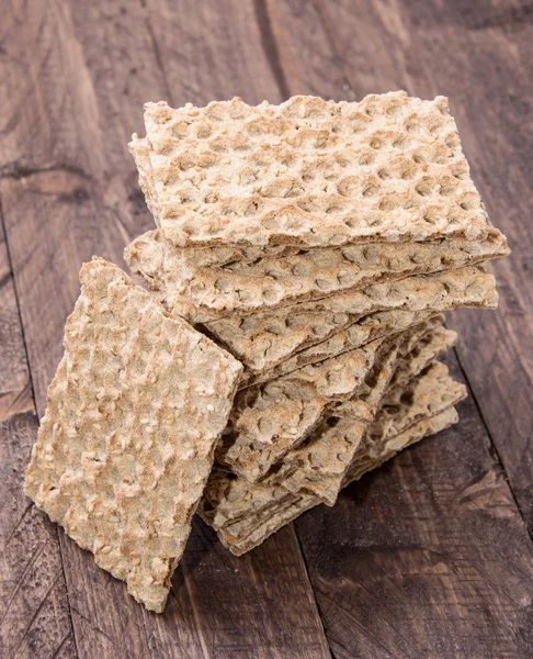 Stacked Crispbread on wood — Stock Photo, Image