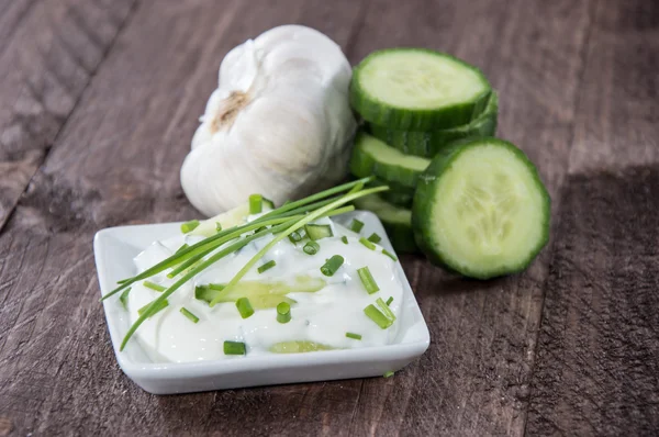Tzatziki with ingredients in a bowl — Stock Photo, Image