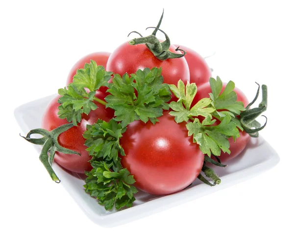Tomatenhaufen auf einem Teller (weiß)) — Stockfoto