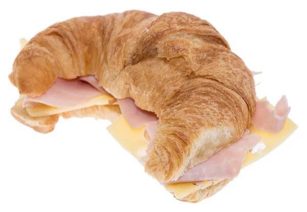 Croissant med skinka och ost på vit — Stockfoto