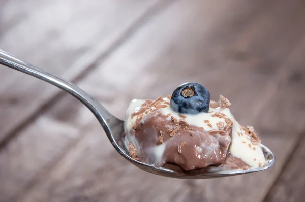 Chocolate Pudding with sauce on a spoon — Stock Photo, Image