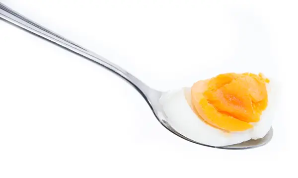 Breakfast Egg on a spoon (white) — Stock Photo, Image