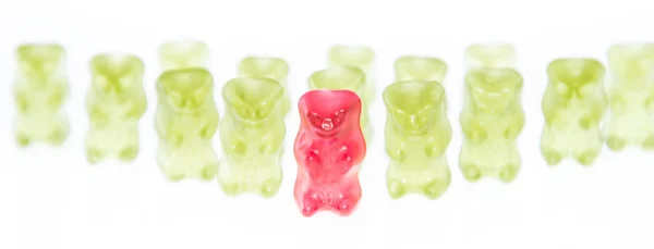 Red Gummi Bear is leading the group — Stock Photo, Image