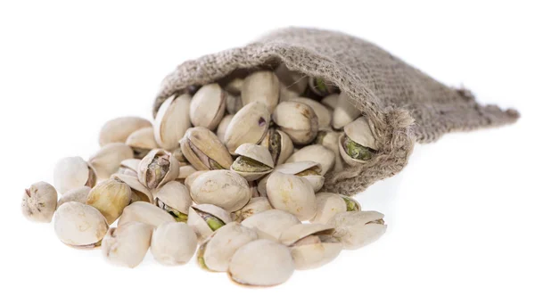 Pistachios in a Bag (on white) Royalty Free Stock Photos