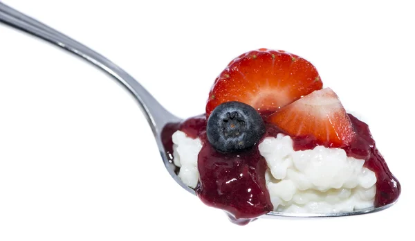 Rice Pudding with fruits on a spoon — Stock Photo, Image