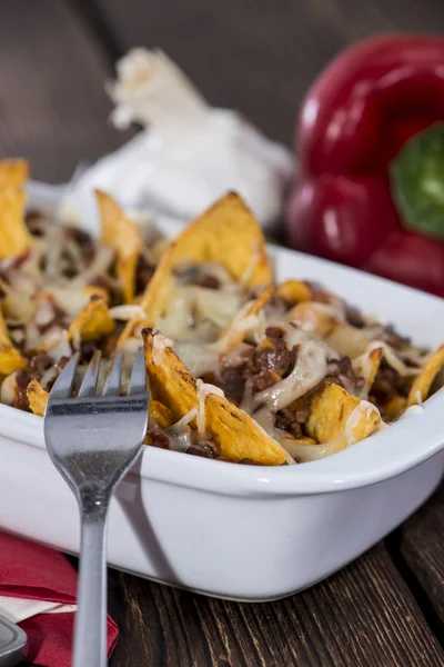 Nachos gratinated with cheese — Stock Photo, Image