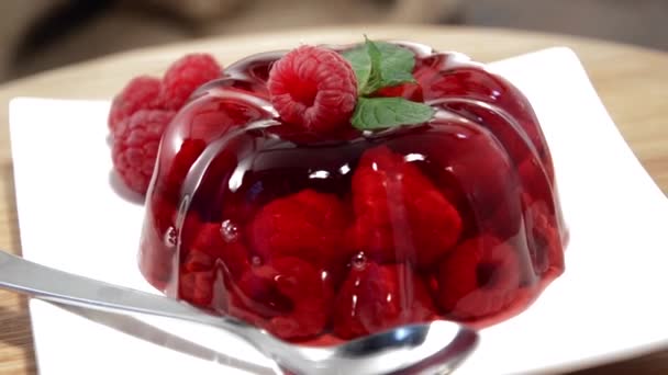 Raspberry Jello with fresh fruits — Stock Video