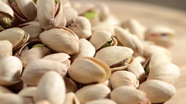 Pistachios on wood — Stock Video