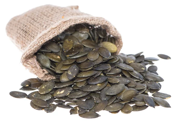 Portion of isolated Pumpkin Seeds — Stock Photo, Image