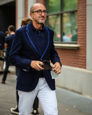 MILAN, Italy- September 22 2021: Men on the street in Milan.