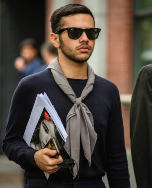 MILAN, Italy- September 22 2021: Men on the street in Milan.