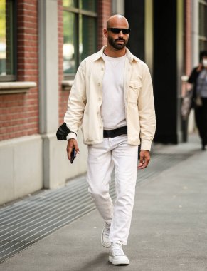 MILAN, Italy- September 22 2021: Men on the street in Milan.