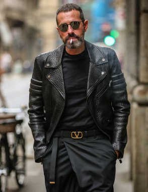 MILAN, Italy- September 25 2021: Men on the street in Milan.