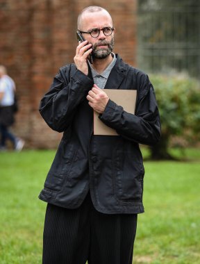 MILAN, Italy- September 25 2021: Angelo Flaccavento on the street in Milan.