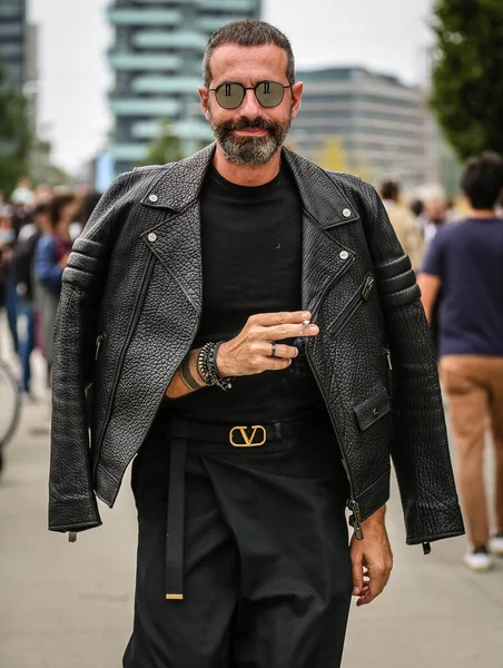 MILAN, Italy- September 25 2021: Men on the street in Milan.