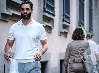 MILAN, Italy- June 21 2021: Men on the street in Milan.