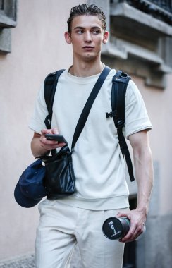 MILAN, Italy- June 21 2021: Men on the street in Milan.