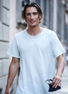 MILAN, Italy- June 21 2021: Men on the street in Milan.