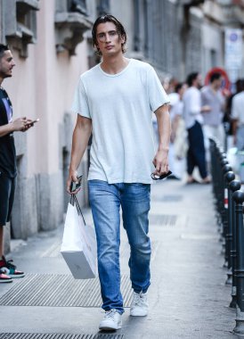 MILAN, Italy- June 21 2021: Men on the street in Milan.