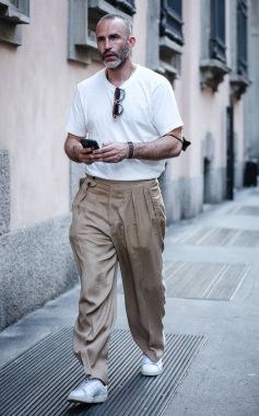 MILAN, Italy- June 21 2021: Men on the street in Milan.