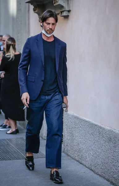 MILAN, Italy- June 21 2021: Men on the street in Milan.