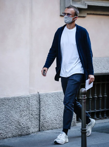 MILAN, Italy- June 21 2021: Men on the street in Milan.