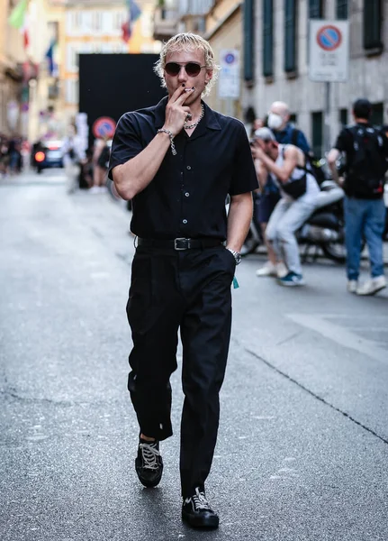 MILAN, Italy- June 21 2021: Men on the street in Milan.