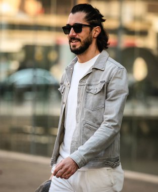 MILAN, Italy- January 16 2022: Men on the street in Milan.