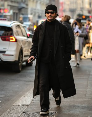 MILAN, Italy- January 16 2022: Men on the street in Milan.