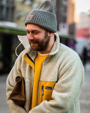 MILAN, Italy- January 16 2022: Men on the street in Milan.